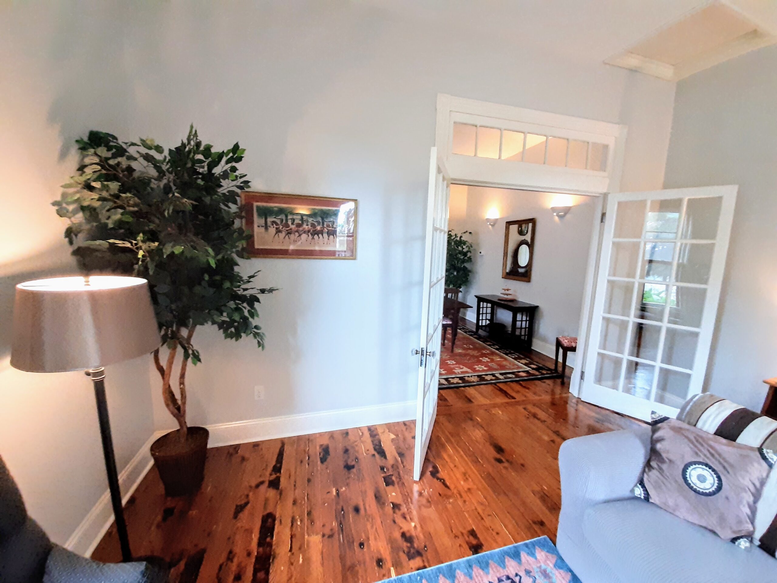 Transom, glass doors, antique wood floors.